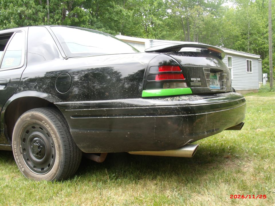 2003 Ford Crown Victoria rear quarter panel with spoiler and aftermarket exhaust