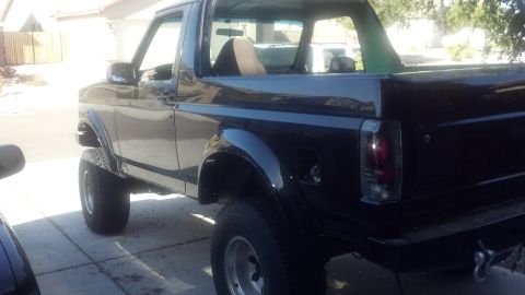 1995 Ford Bronco - This lifted 1995 Ford Bronco is shown from the rear quarter angle.
