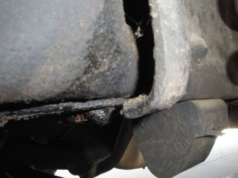 1988 Ford F-250 - This photo shows a close-up view of a vehicle's undercarriage, focusing on frame and suspension parts.