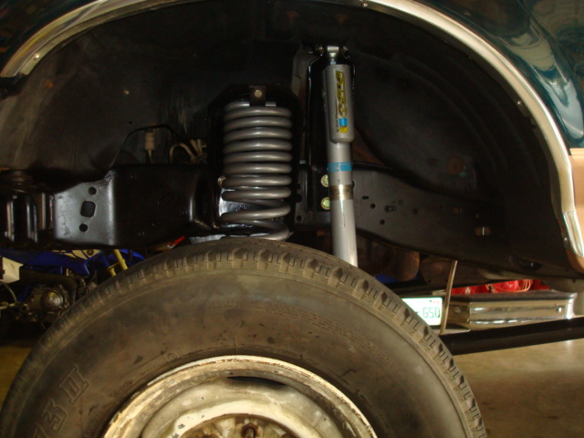 Green Ford Bronco rear wheel well with coil spring and Bilstein shock absorber