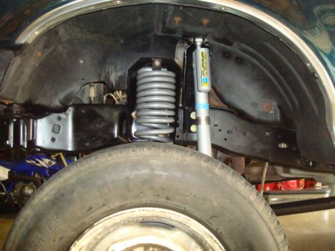 1995 Ford Bronco - Front suspension components including a coil spring and shock absorber are visible near the tire.