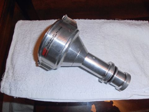 1990 Ford Bronco - A metal distributor part is shown resting on a white towel.
