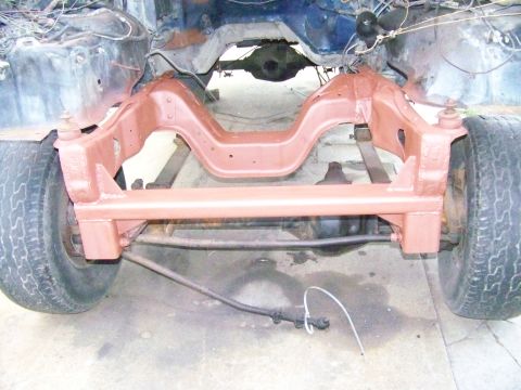 1985 Ford Bronco - The frame and suspension of a vehicle are shown from the front, with the body removed.