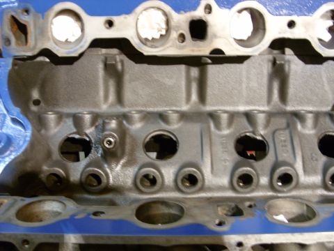 1967 Ford F-250 - Close-up view of an engine block, showing its internal structure and bolt holes.