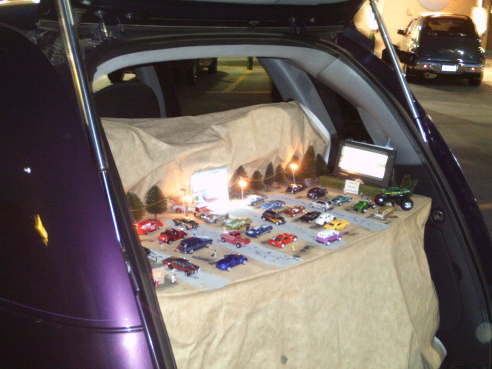 Trunk tailgate display of die-cast model cars set up as a mini car show