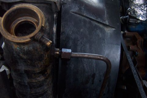 1980 Ford Bronco - Close-up view of a vehicle's radiator and fan shroud, showing engine components.