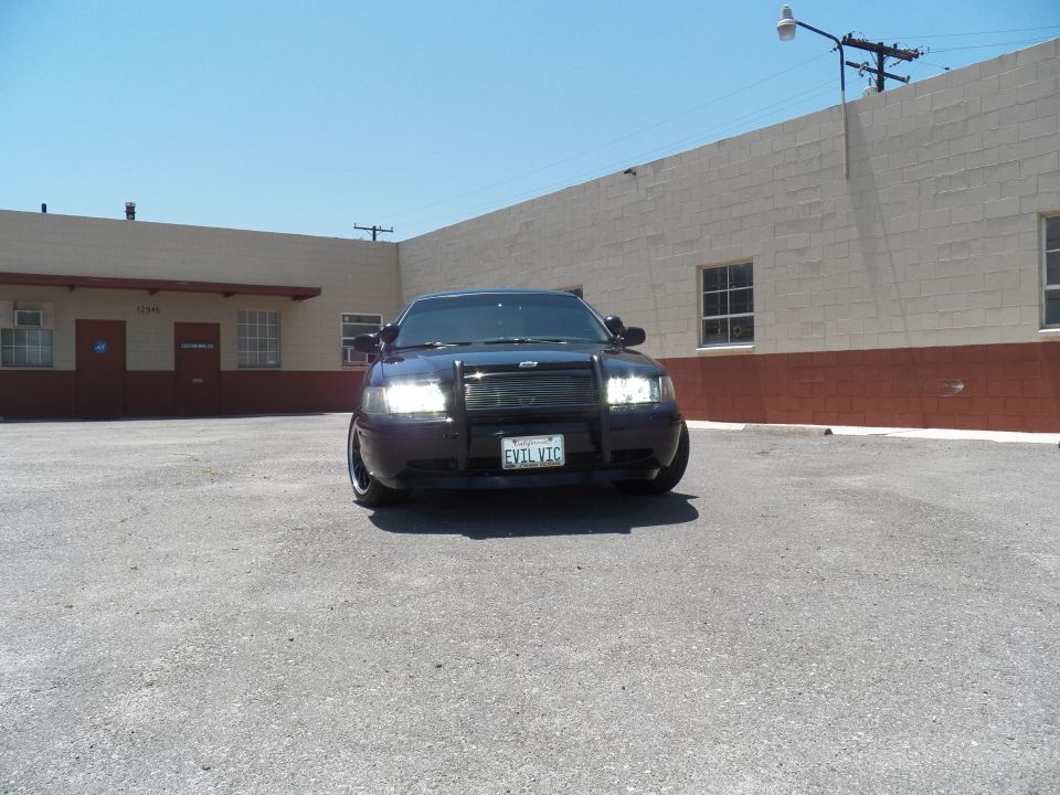 Black Ford Crown Victoria front view with grille guard and billet grille, CA plate EVIL VIC