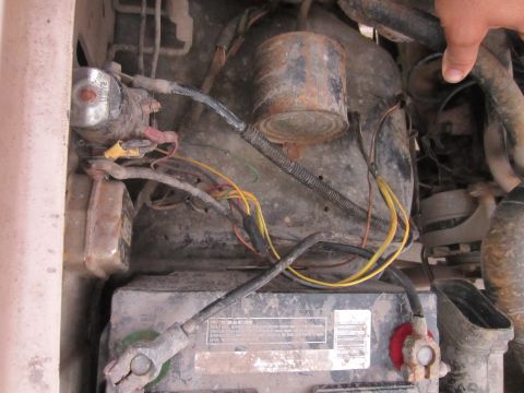 1982 Ford Bronco - Close-up view of the engine bay, showing the battery and various electrical components and wiring.