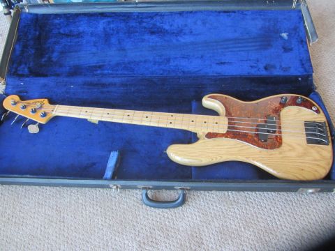 1968 Ford Mustang - A Fender Precision Bass guitar rests in its open blue velvet-lined case.