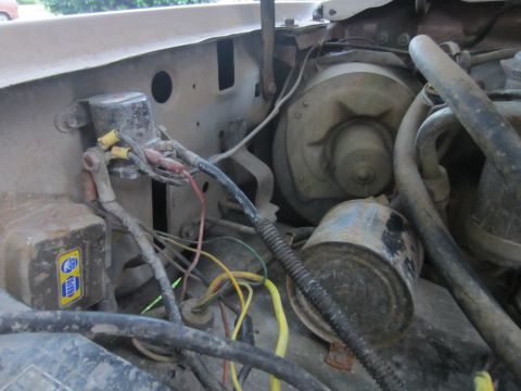 1982 Ford Bronco - Close-up view of engine bay wiring and components, including a NAPA sticker.