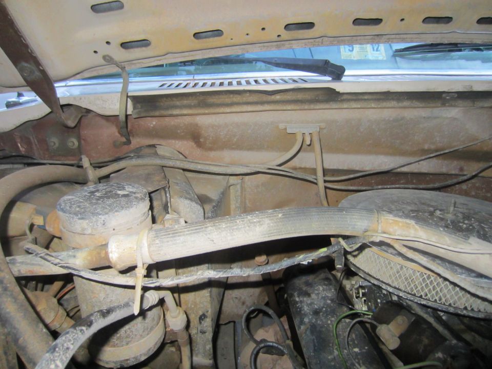 1982 Ford Bronco engine bay, showing hoses, air cleaner, and engine components