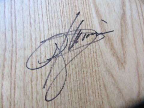 1968 Ford Mustang - Autograph on wood grain surface.