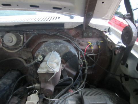 1982 Ford Bronco - Close-up view of engine bay components, including the brake fluid reservoir and wiring harness.