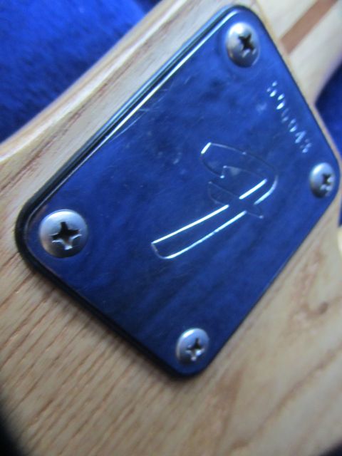 1968 Ford Mustang - Close-up of a Fender neck plate with serial number 300043.
