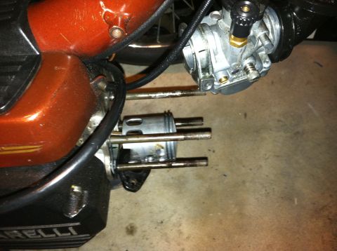 1981 Garelli Rally Sport - A close-up view shows a motorcycle's engine cylinder and carburetor assembly, with visible bolts and tubing.
