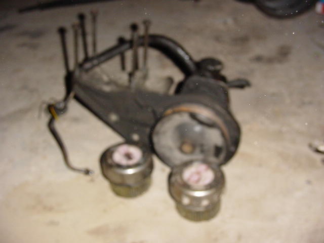 Steering component with two cylindrical parts and bolts