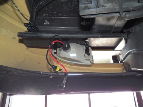 2003 Ford Crown Victoria - Gray HID ballast with red and black leads fitted in a tan-painted engine bay corner.