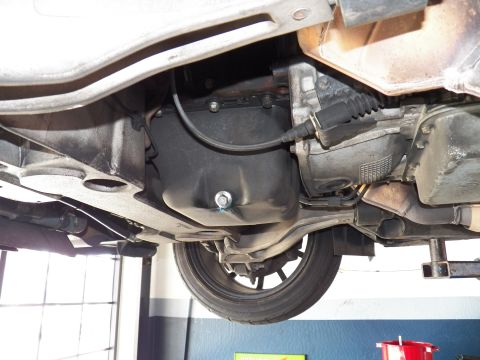 2003 Ford Crown Victoria - Underbody shot of a vehicle's transmission, exhaust pipe and floor pan from below