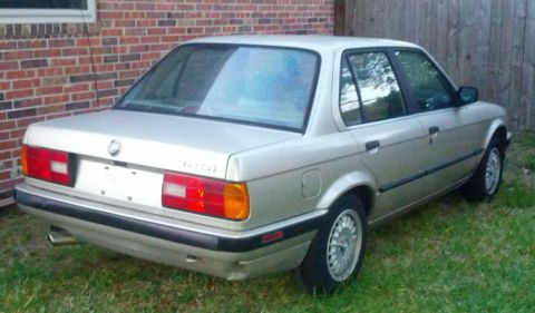 1989 BMW 3 Series - Rear view of a silver 1989 BMW 3 Series sedan parked on grass.