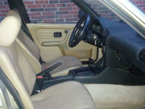 1989 BMW 3 Series - Interior of a 1989 BMW 3 Series, tan upholstery and the dashboard.
