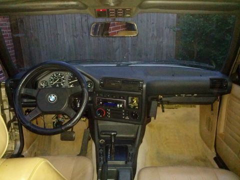 1989 BMW 3 Series - Interior view of a 1989 BMW 3 Series, highlighting the dashboard, steering wheel, and seating area.