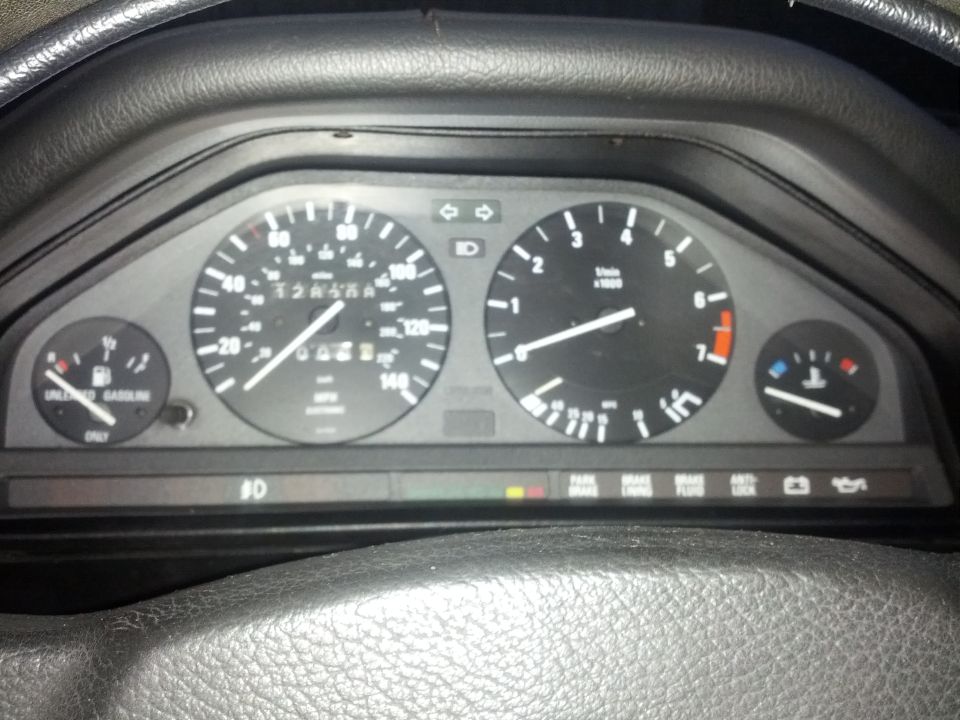 1989 BMW 3 Series dashboard gauges with odometer reading 128456