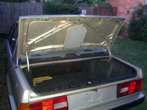 1989 BMW 3 Series - Rear view of a 1989 BMW 3 Series with the trunk open, revealing the cargo area.