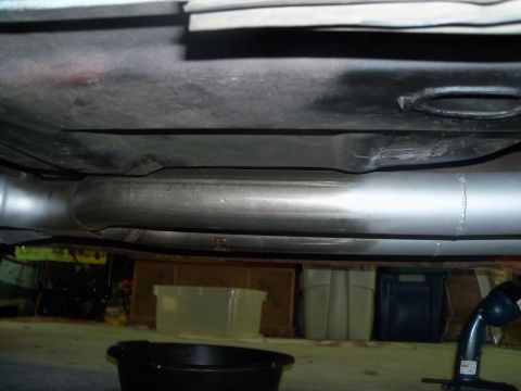 1979 Ford Ranchero - 3" dual exhaust tucked up in trans tunnel. System includes: Ceramic coated Hooker 6126 headers, Jegs 3" x 18" collector extensions, Pypes b…