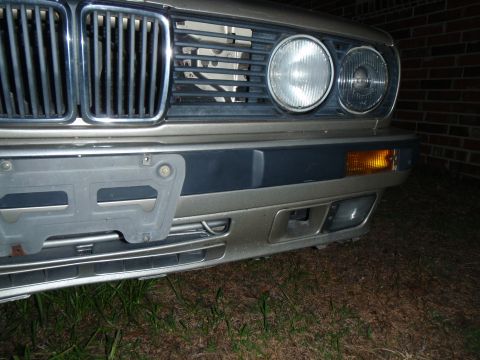 1989 BMW 3 Series - Close-up of the front end of a 1989 BMW 3 Series, including the grille and headlights.