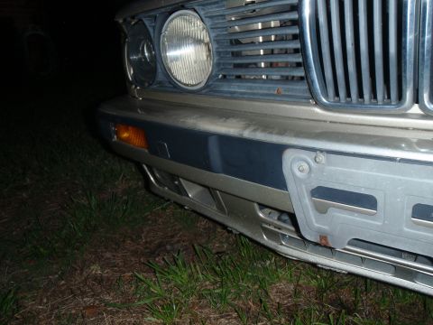 1989 BMW 3 Series - Close-up of a vintage BMW's front end, showing the grille and bumper details.