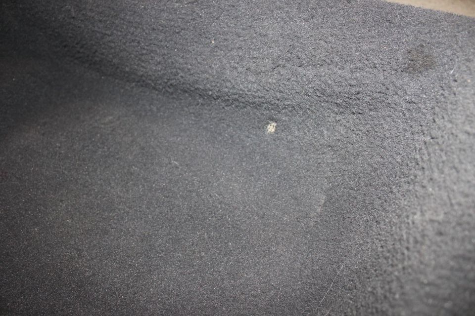small burn hole on driverside rear