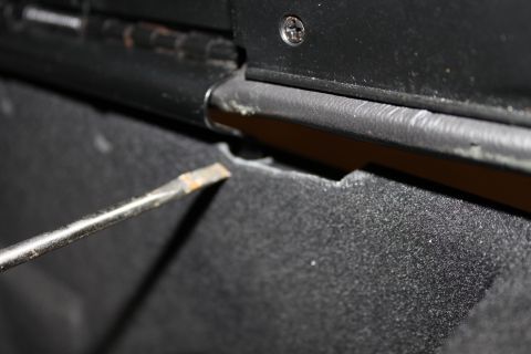 2003 Ford Crown Victoria - inside storage bin cracked.