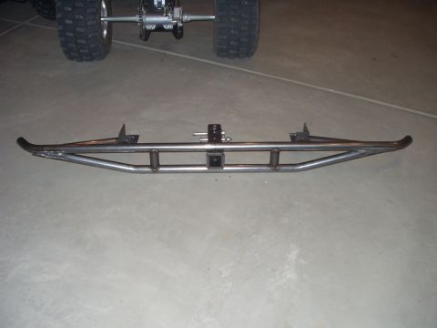1993 Ford Bronco - Custom metal bumper with hitch receiver shown on a concrete floor, with an ATV rear axle in the background.