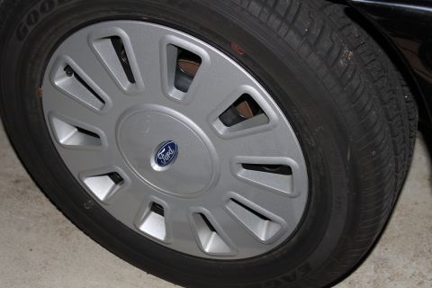 2003 Ford Crown Victoria - 2006 full wheel covers, two sets A- to B condition.