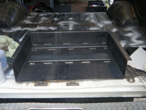 1988 Ford E350 - Custom metal storage box fitted into the rear cargo area of a van.