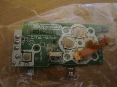 1963 Ford Falcon - Close-up of a Nintendo Game Boy Advance SP motherboard, showing various components and connectors.