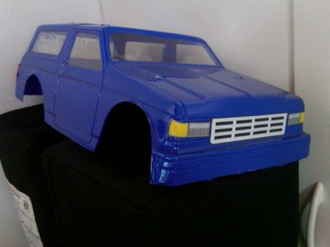 1986 Ford Bronco - This blue 1986 Ford Bronco RC car body features a distinctive grille and front-end styling.