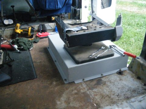1988 Ford E350 - Swivel seat base and tools in a workshop setting.