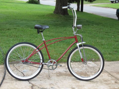 1994 Ford Bronco - Cruiser bicycle with whitewall tires and chrome handlebars.
