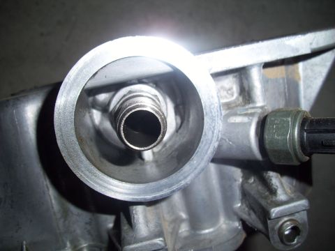 2003 Hyundai Tiburon - This is a close-up view of a vehicle's oil filter housing, showing the threaded nipple where the filter attaches.