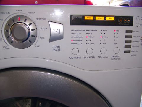 2000 Jeep Wrangler - The control panel of a washing machine shows various cycle options and settings.