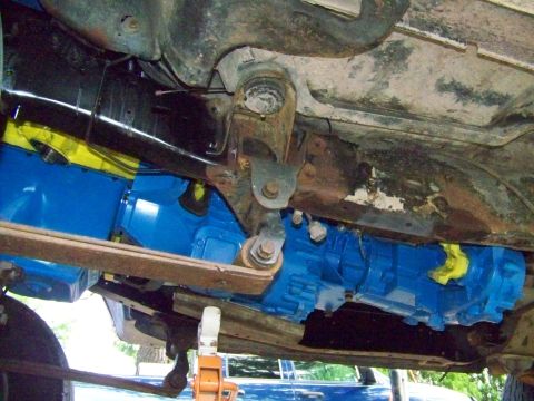 1985 Ford Bronco - Undercarriage view shows a newly painted blue transmission, likely part of an engine swap.