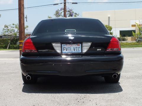 2003 Ford Crown Victoria - Straight rear; Ford oval, SVT badge, EVIL VIC California plate, CROWN VICTORIA frame