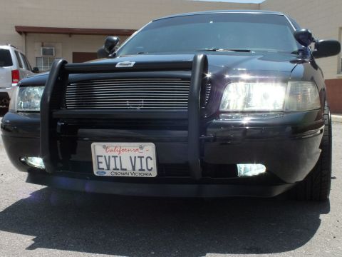 2003 Ford Crown Victoria - Ground-level shot of a black Crown Victoria grille guard and Ford EVIL VIC plate.