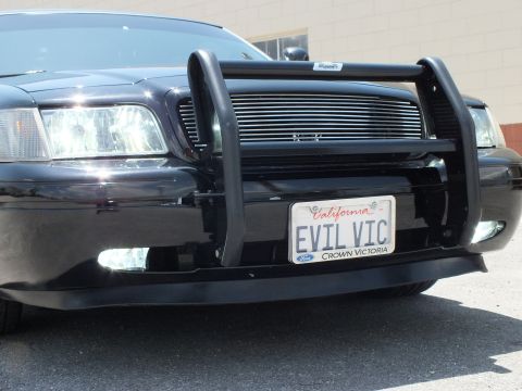 2003 Ford Crown Victoria - Close front detail of a Crown Victoria push bar, billet grille and EVIL VIC plate.