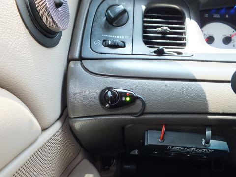 2003 Ford Crown Victoria - Dash detail showing the headlight knob, vents and a small lit aftermarket switch with LEDGLOW box.