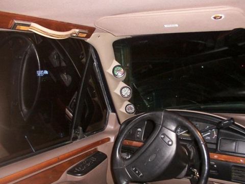 1995 Ford Bronco - The interior of a 1995 Ford Bronco features a dashboard with gauges and a steering wheel.