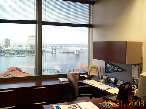 1992 Ford Bronco - Office interior overlooking a waterfront cityscape with a bridge in the distance.