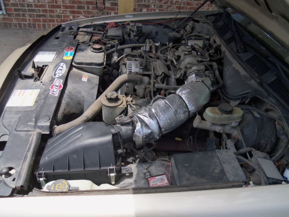 2000 Mercury Grand Marquis engine bay with aftermarket air intake insulation