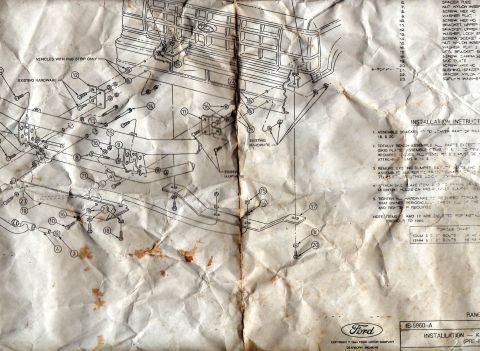1999 Ford Ranger - Exploded assembly diagram on a worn installation sheet showing bumper mounting hardware with numbered parts, a parts list, and bolt torque…